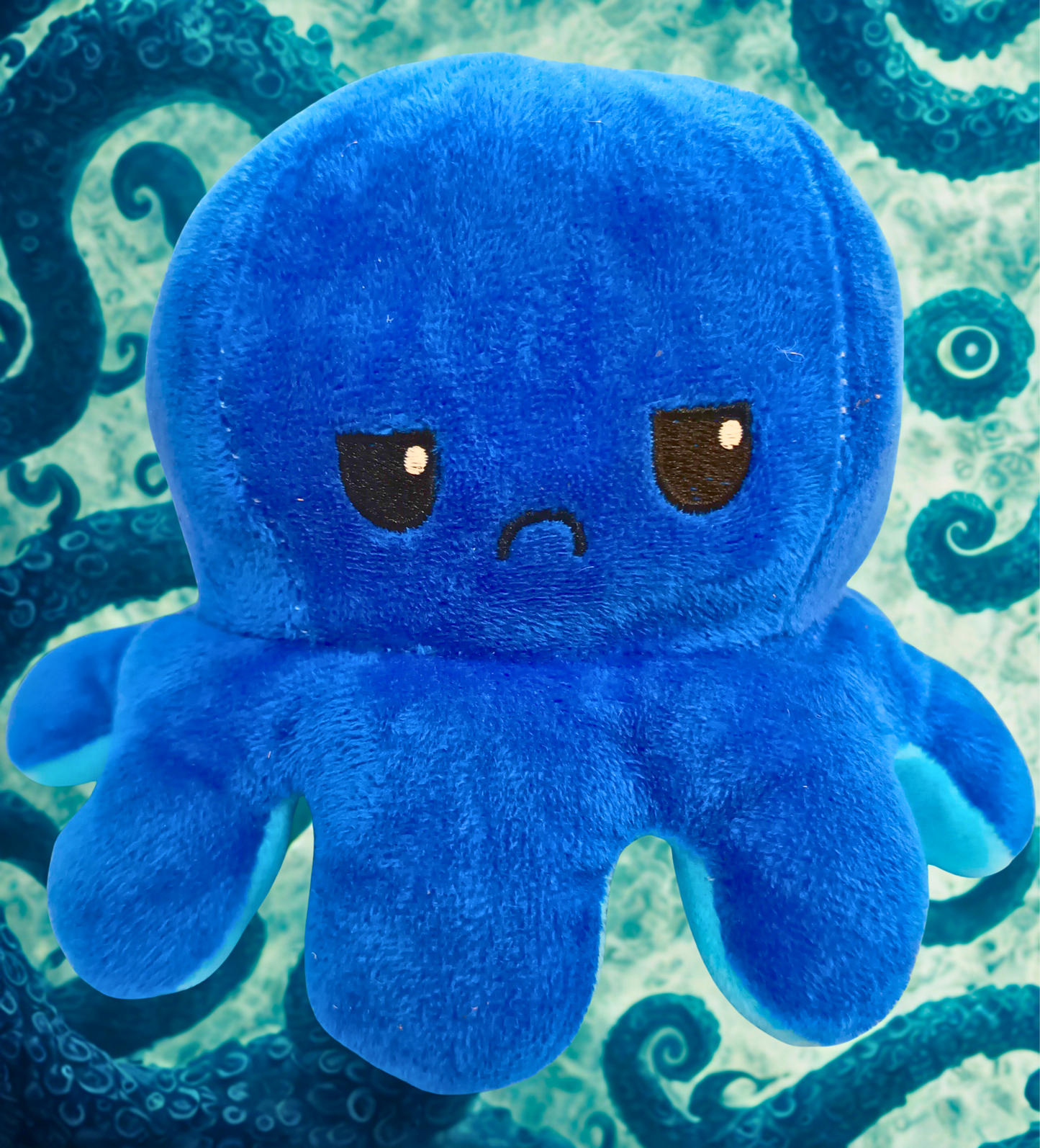 Reversible Mood Octopus Plush.